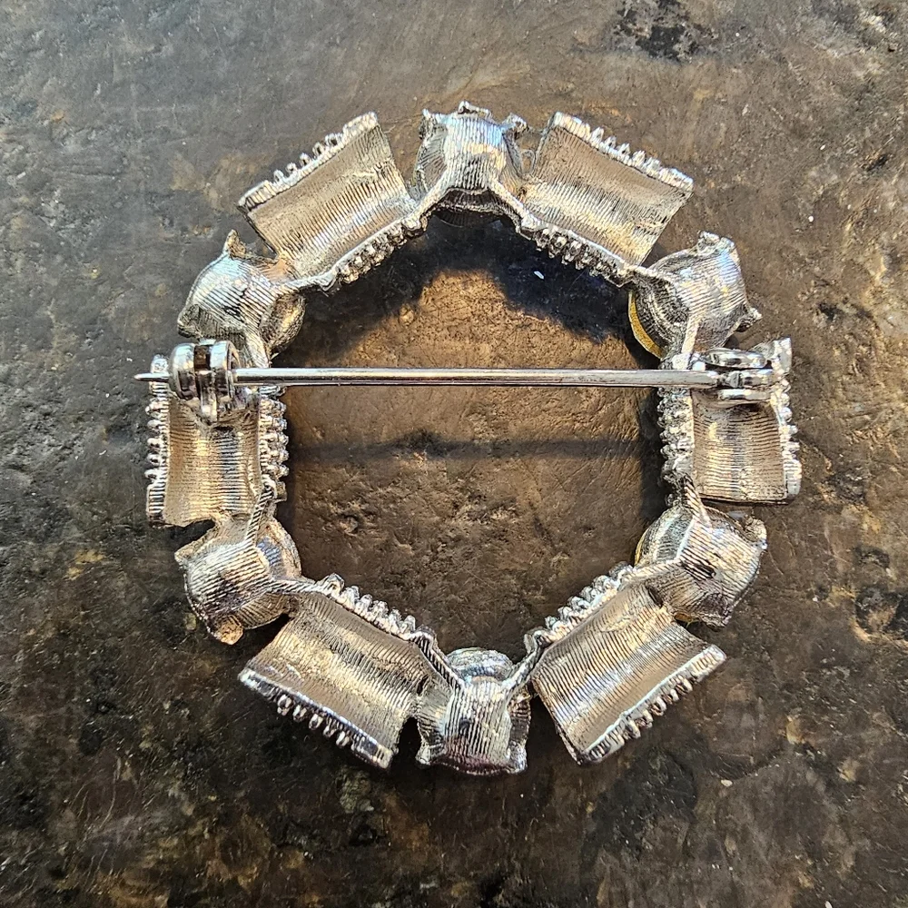 Vintage silvertone and Rhinestone circular brooch